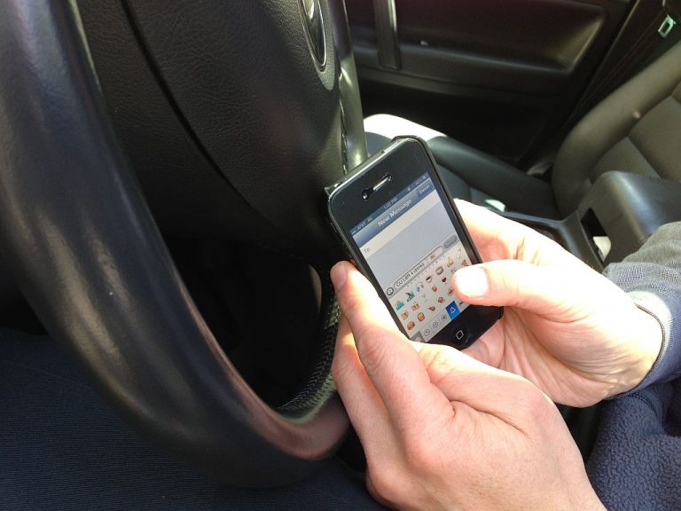 a driver texting and driving.
