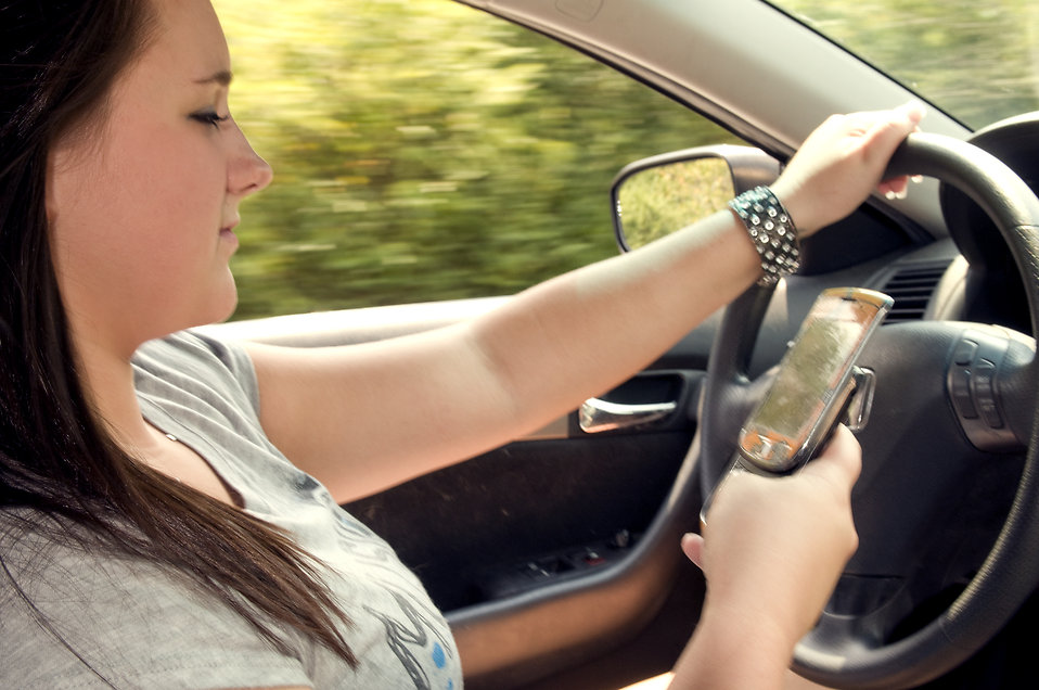 A Teen texting and driving