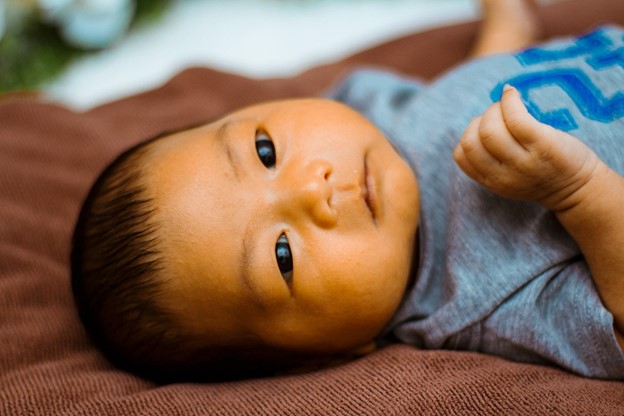 Image via Unsplash a baby lying down
