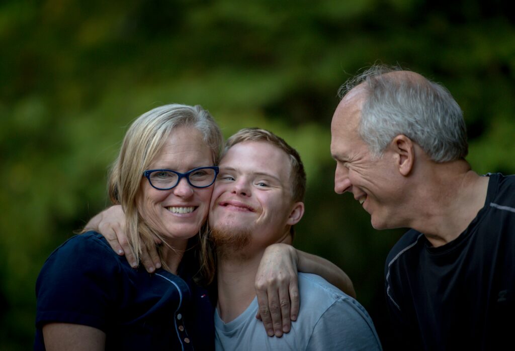 a Family smiles and shares a hug in Kennesaw, GA